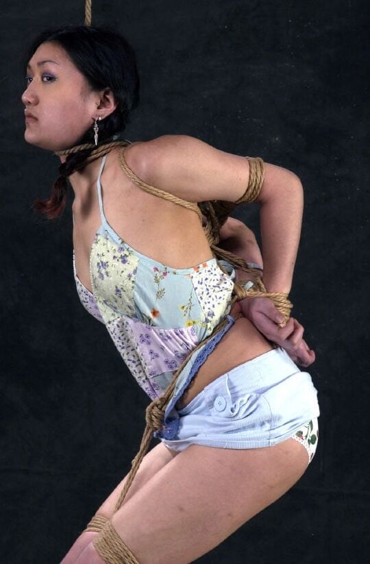 Submissive chink whore in bondage for our use