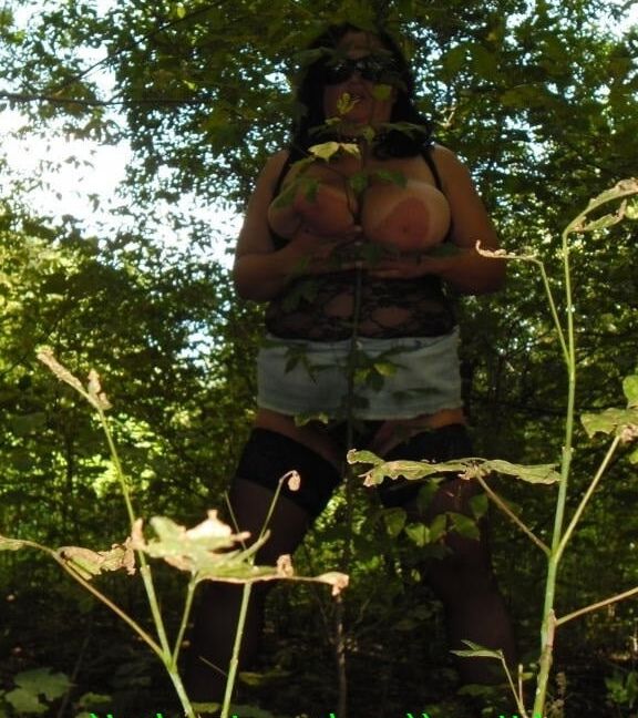 Photo of a fat mother in nature, pussy close-up