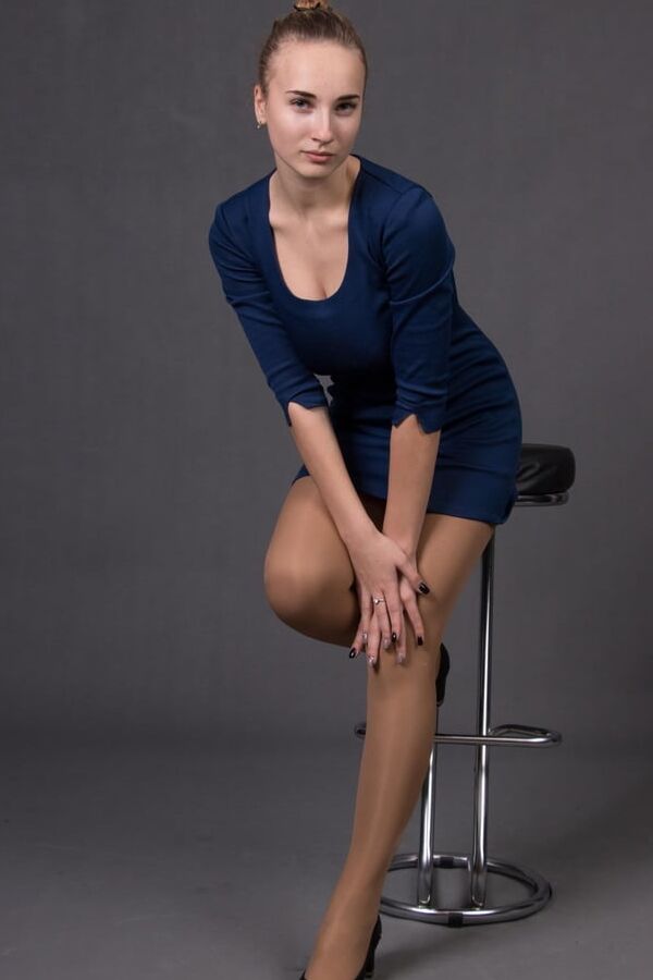 Tidy Russian Bitch Posing in Tan Pantyhose