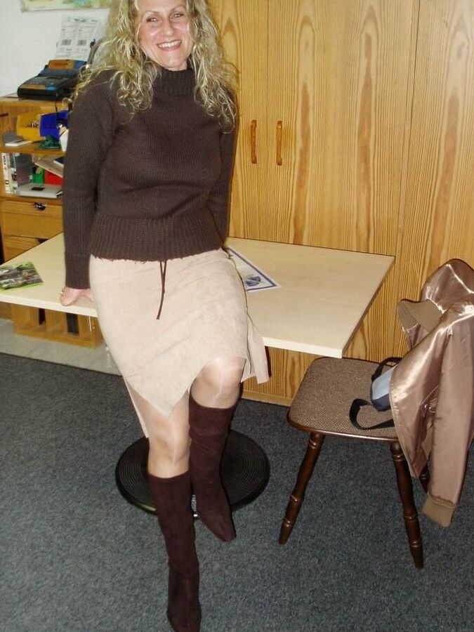 Mature German slut wearing sexy lingerie and shiny stockings