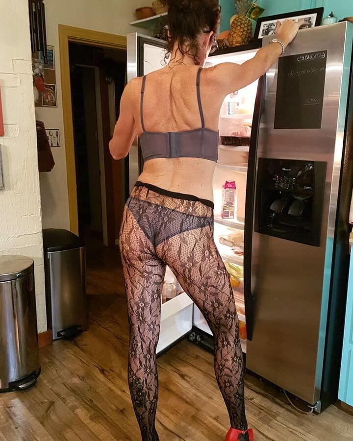 Horny amateur mature teasing in kitchen