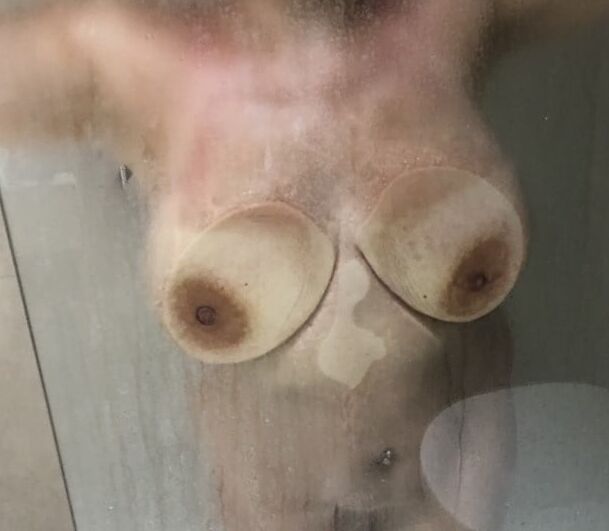 Boobs and butts against shower door