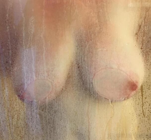Boobs and butts against shower door