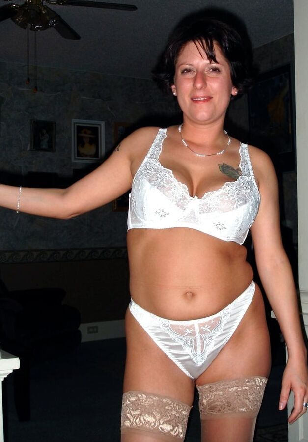 Tattooed MILF wearing various tan stockings