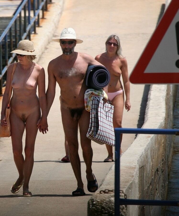 Nudist On The Beach.