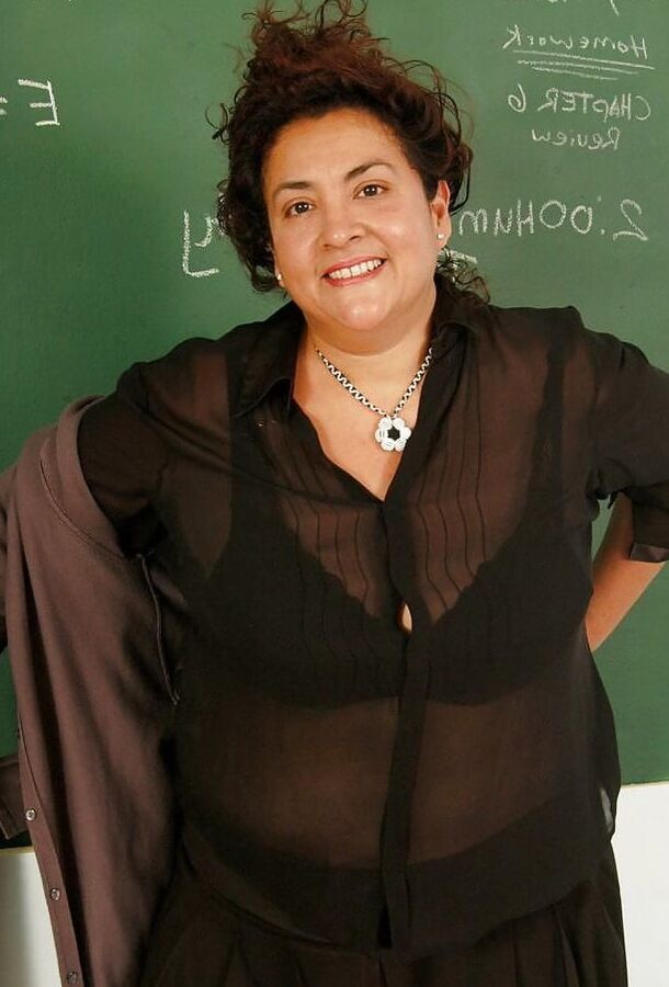 Mature teacher strips down to just her fishnet stockings