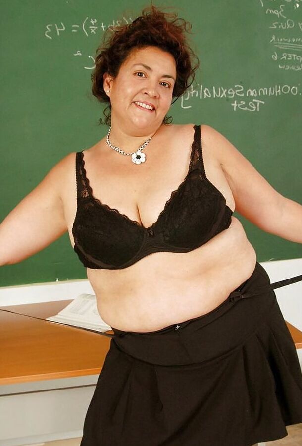 Mature teacher strips down to just her fishnet stockings
