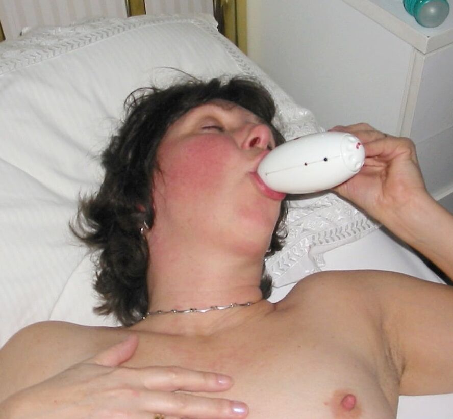 Charming mature sucking their dildo