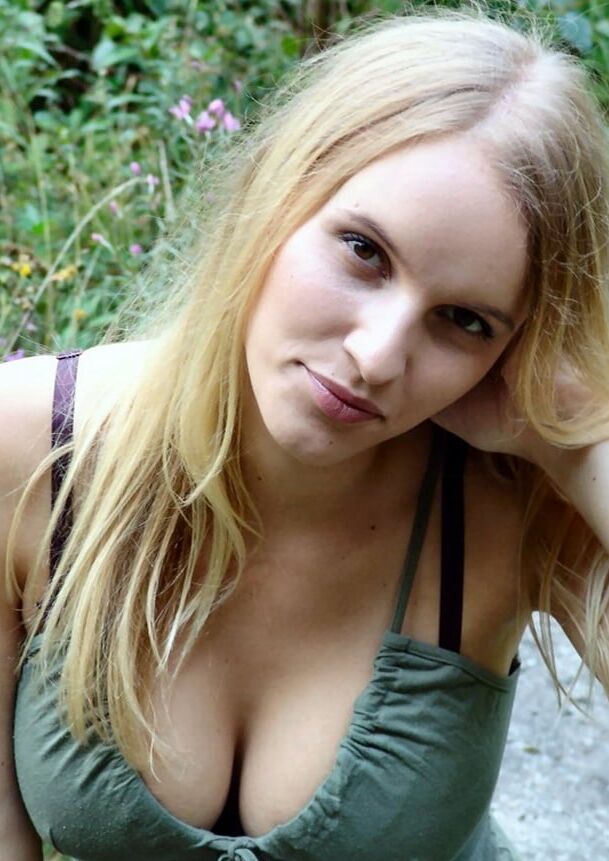 Amateur blonde with nice big tits posing