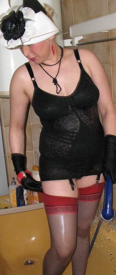 Royally dressed mature takes a shower