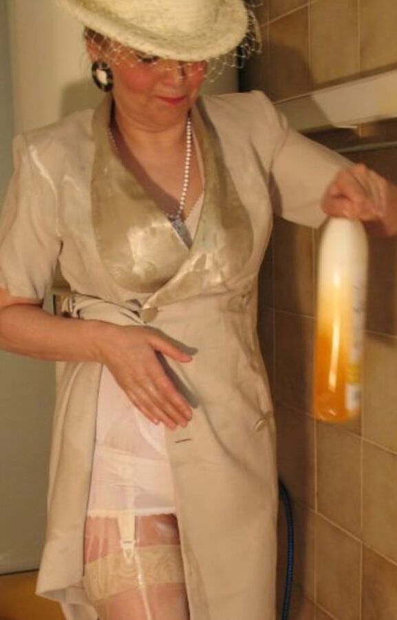 Royally dressed mature takes a shower