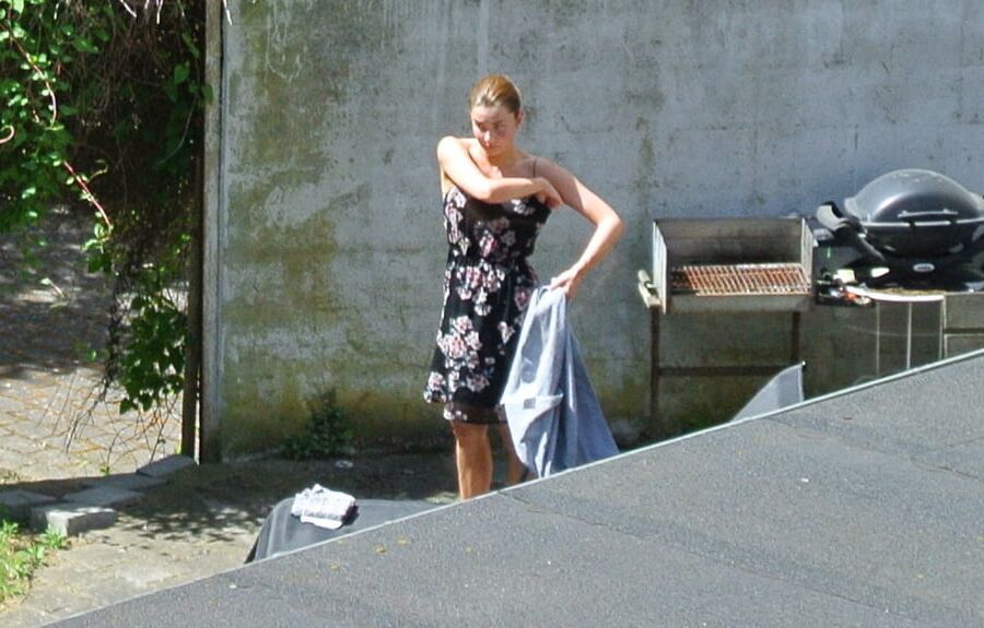 Hot girl getting taned in the yard