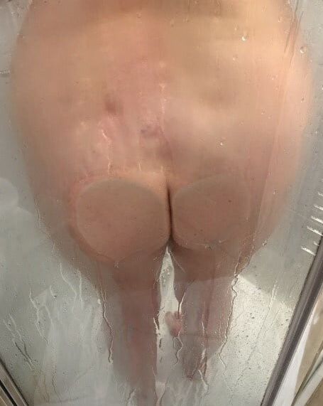 Boobs and butts against shower door