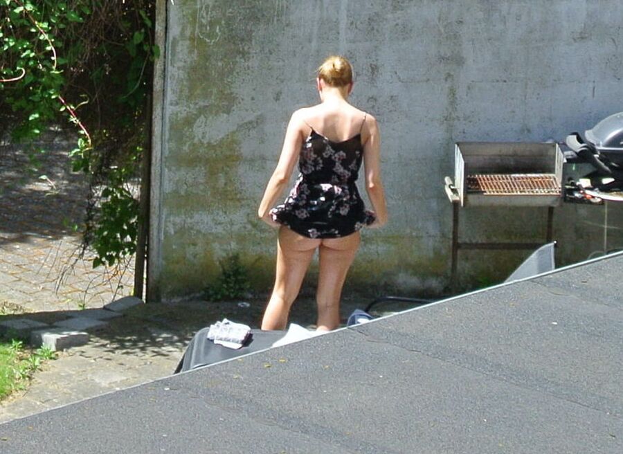 Hot girl getting taned in the yard