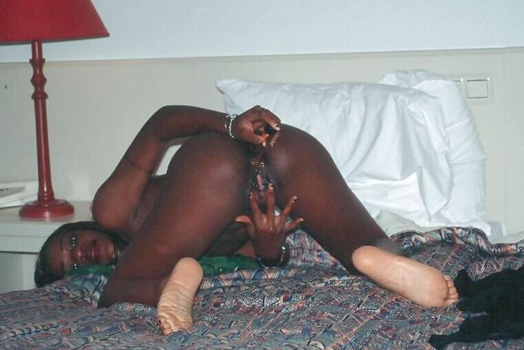 Black girl playing with dildos