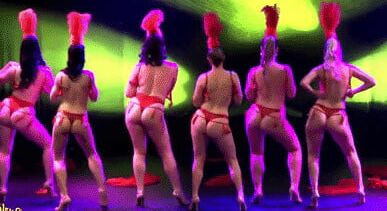 Burlesque women in red thongs