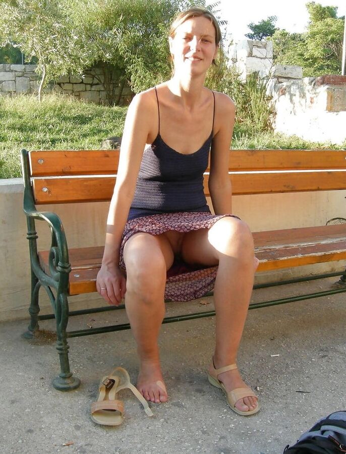 Skinny MILf slut flashes her cunt upskirt in public