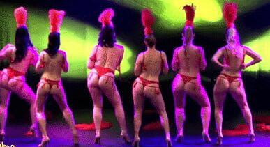 Burlesque women in red thongs