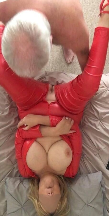 LINDA in a red jumpsuit inch heals