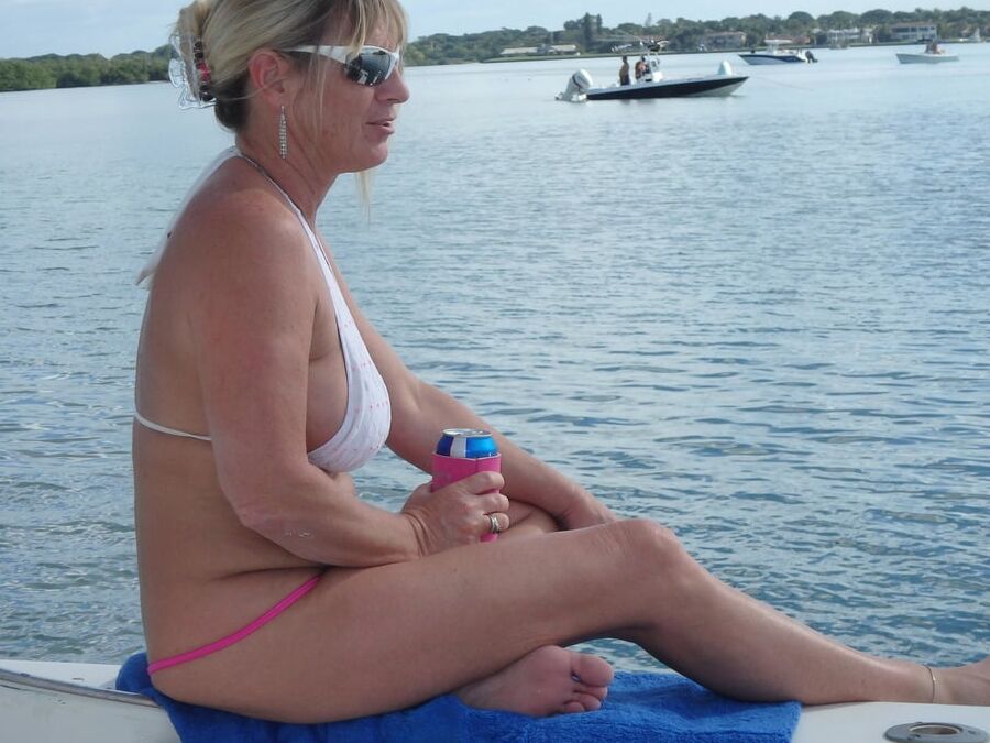 Slut Milf Brandi Jaimes in boat with her hubby and her bull