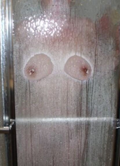 boobs against shower door