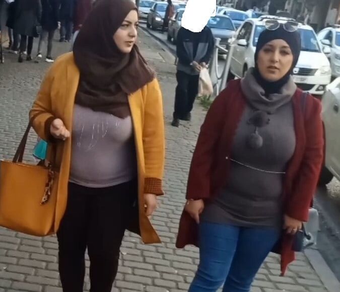 tow arabian hijab girls with huge boobs spy in street