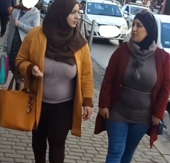 tow arabian hijab girls with huge boobs spy in street