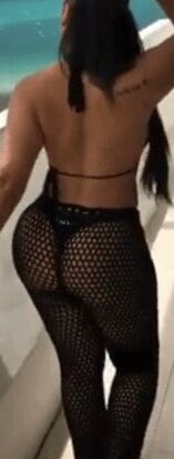 Sexy woman in black thong and mesh pants