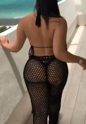 Sexy woman in black thong and mesh pants