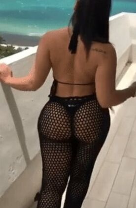 Sexy woman in black thong and mesh pants
