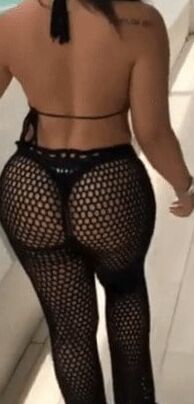 Sexy woman in black thong and mesh pants