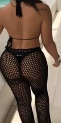 Sexy woman in black thong and mesh pants