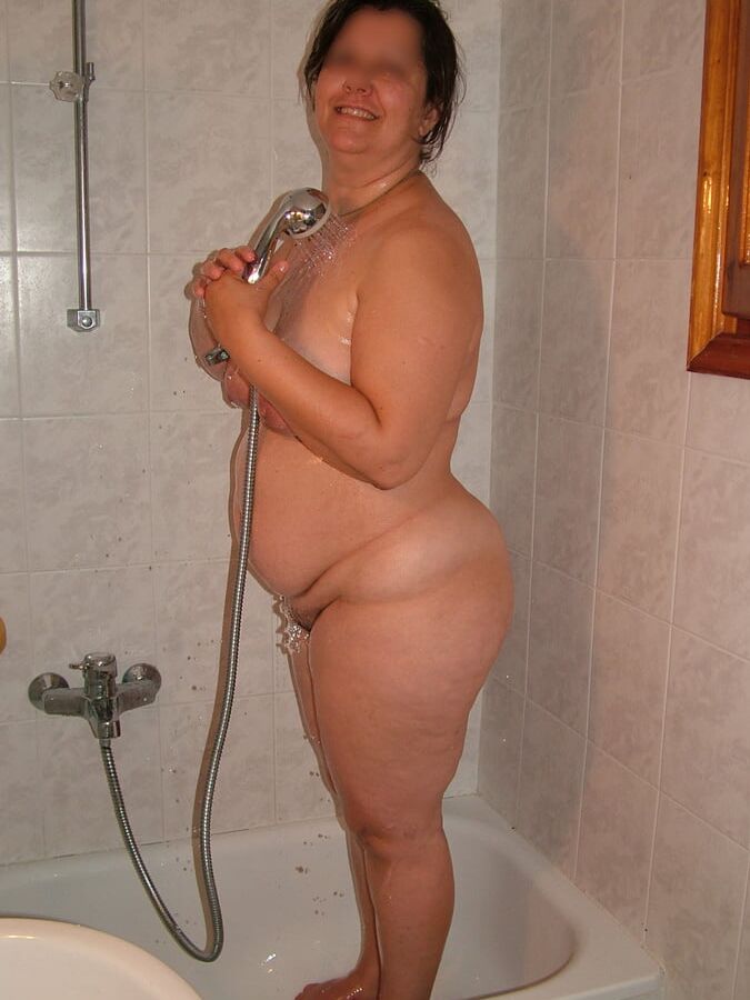 Taking a shower in the bathroom