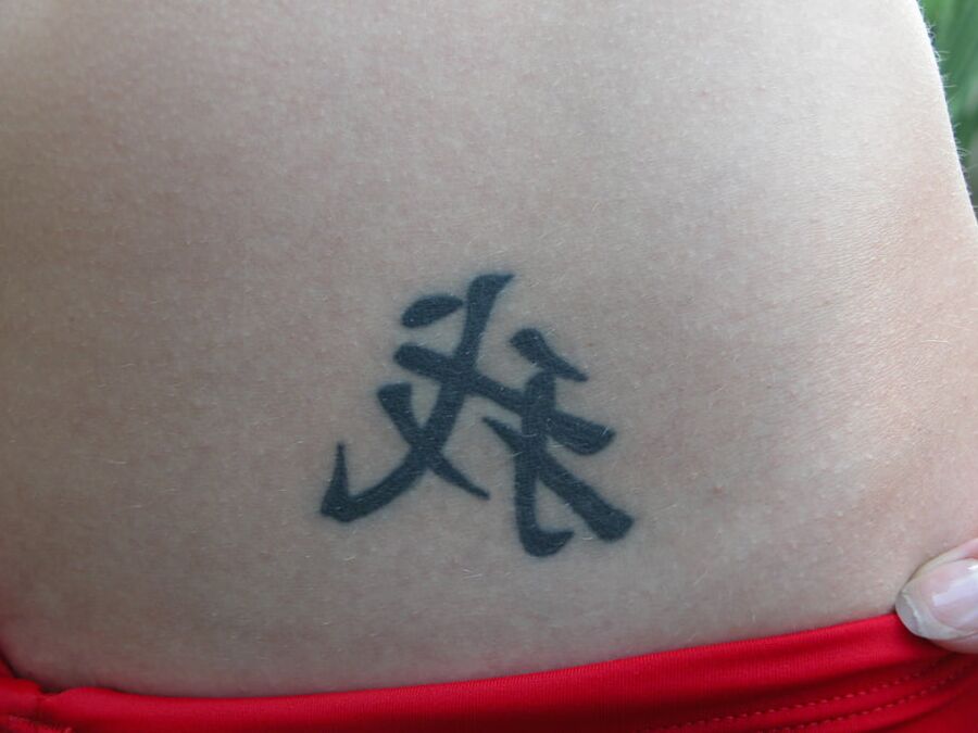 With a tattoo