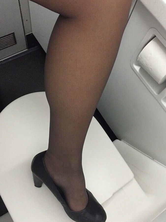 Sexy Stewardess in Heels and stockings
