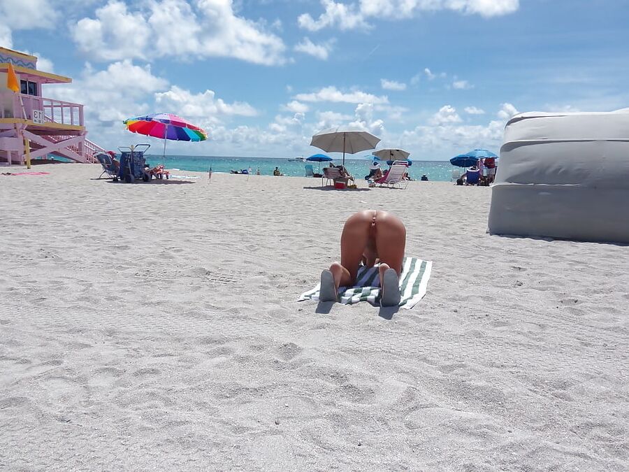American Nude Beach Slut Bending Over and Spreading Legs
