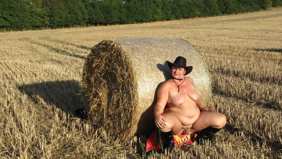 Anna naked on straw bales ...