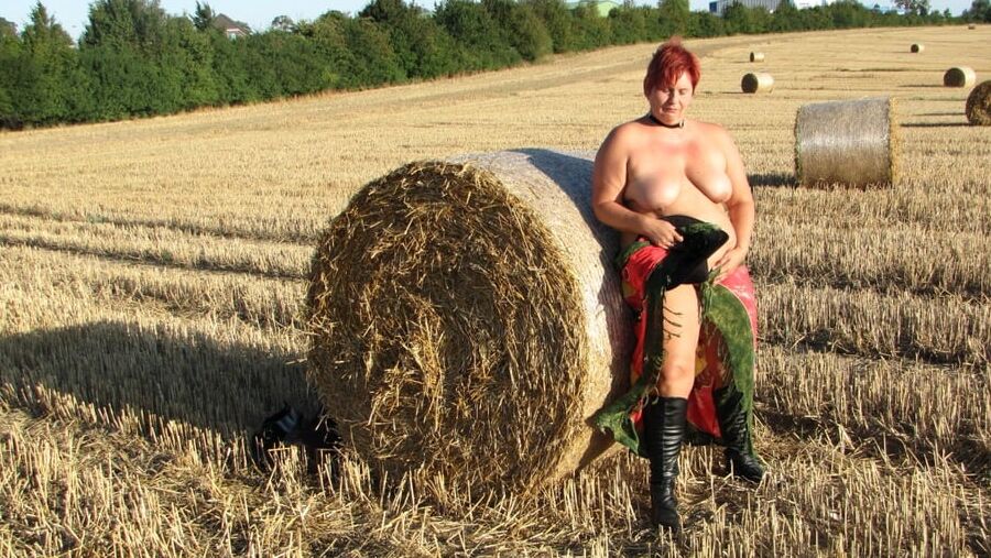 Anna naked on straw bales ...