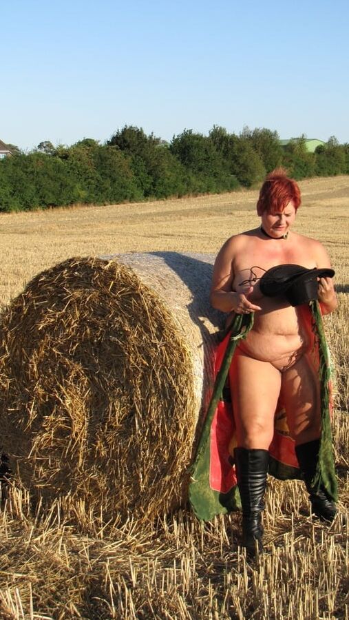 Anna naked on straw bales ...