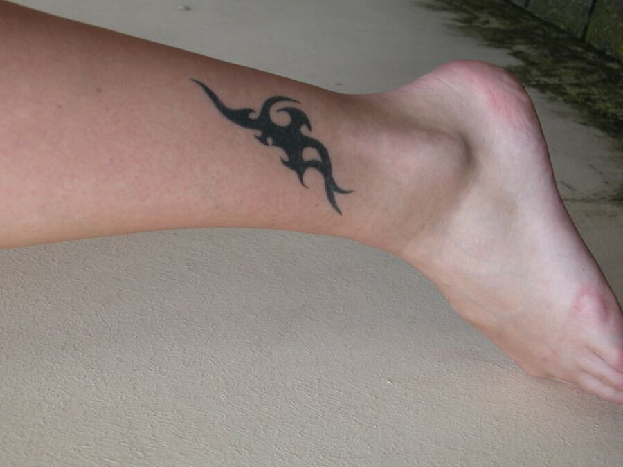 With a tattoo