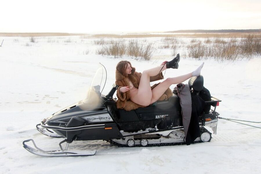 Girl in fur coat posing