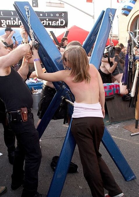 Girl getting a back flogging at Folsom Fair