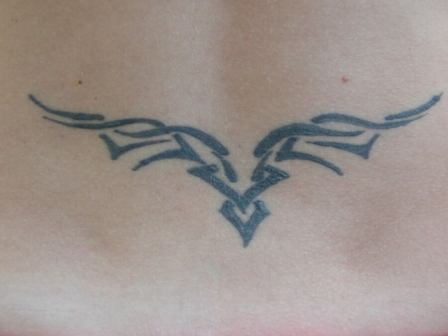 With a tattoo