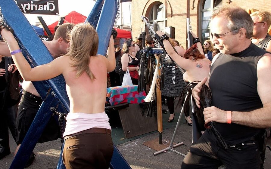 Girl getting a back flogging at Folsom Fair