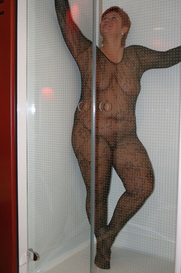 Posing in a black catsuit ...