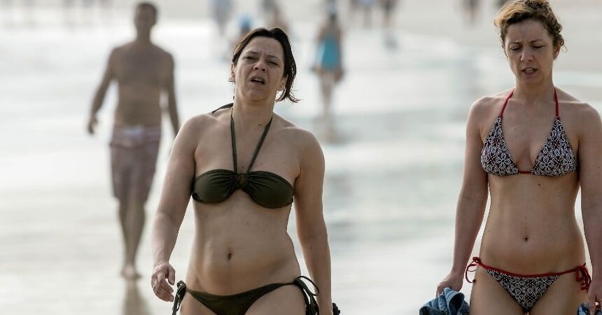 All types of women in the beach .