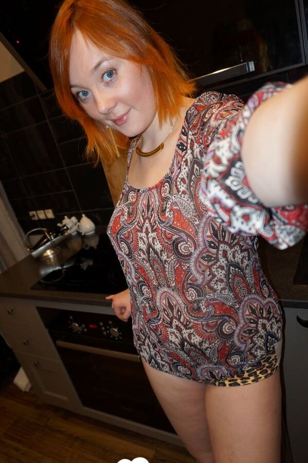 Hot redhead knows how to tease on camera