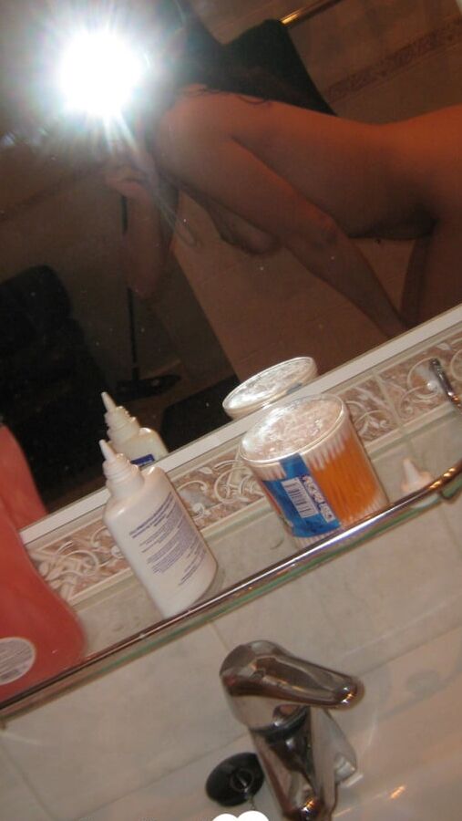 Innocent brunette teasing in her own bathroom