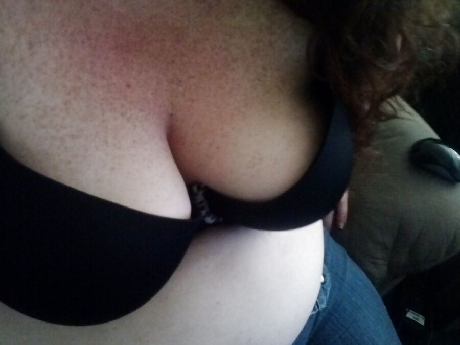 Nerdy cutie displays the tattoo on her chest