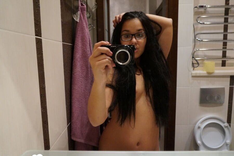 Cute nerdy babe taking some hot selfies
